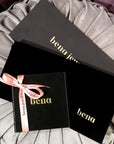 bena jewelry ring packaging black boxes on grey background