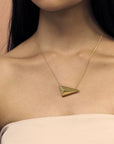 Woman wearing statement gold plated pendant Bena Jewelry Edgy Collection