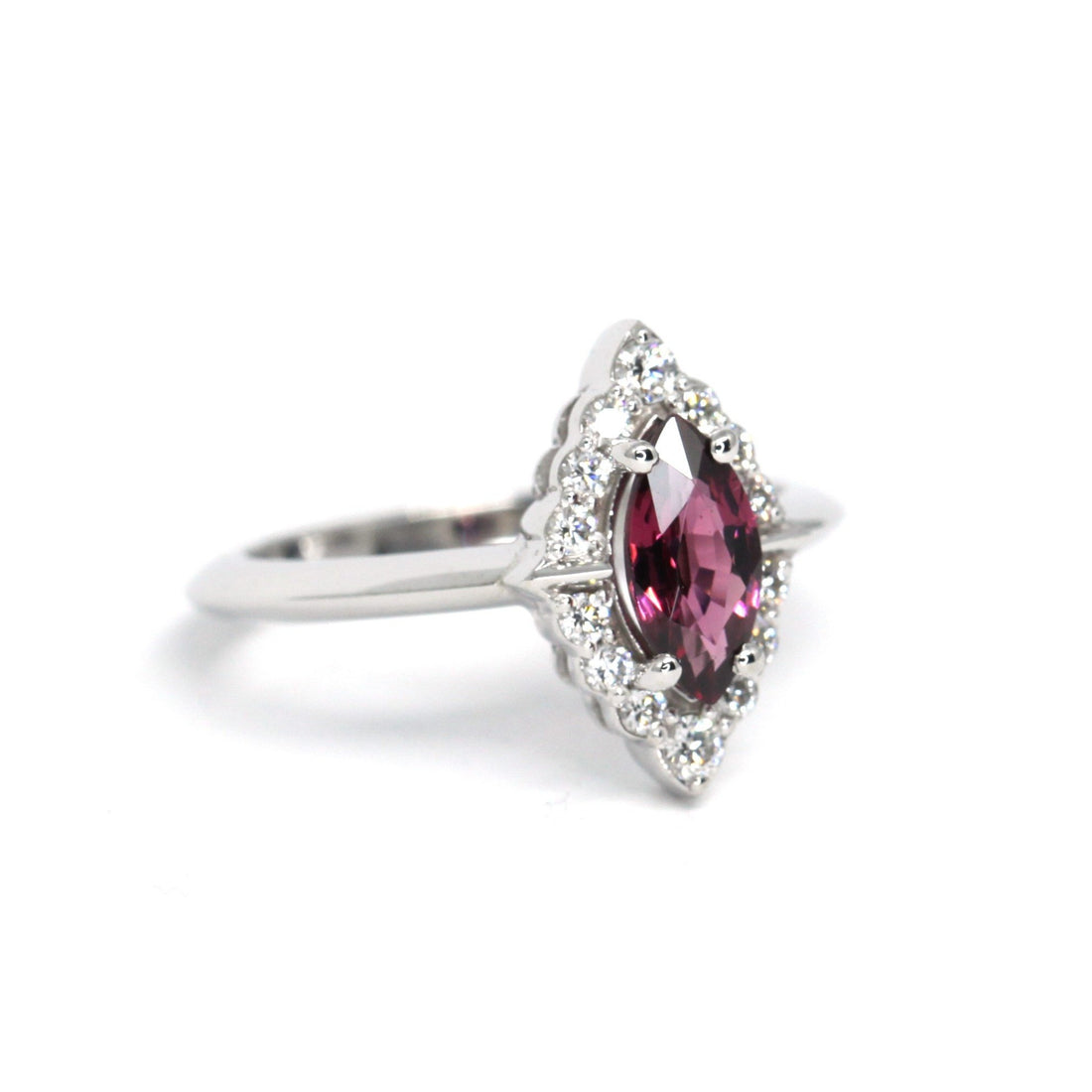 Side view of maquise shape red rhodolite garnet modern engaegement ring small white edgy diamonds jewelry montreal made in canada white gold red gemstone bridal engagement ring montreal made in canada
