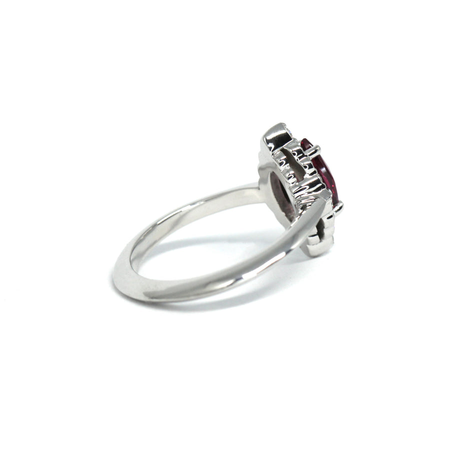 Back view of bena jewelry white gold ring with small diamond and marquise shape red gemstone garnet red rhodolite engegagement ring custom made in montreal fine jewelry designer montreal