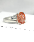 Side view of cocktail ring orange color gemstone custom made silver ring big bold color gems silver fine jewelry glitter hemmatite inclusion gems from india ring design made in montreal handemade in canada