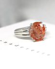 Side view custom made cocktail ring sunstone gemstone fine jewelry montreal made in canada bold cocktail gems for unique jewelry edgy fashion style montreal made in canada custom made ring with orange sparkling gemstone silver ring bena jewelry edgy collection
