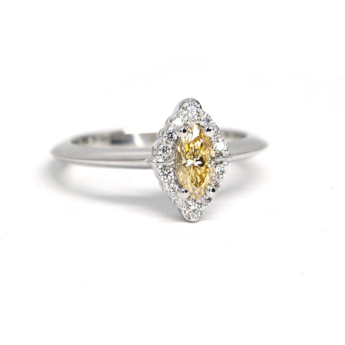 Quater side picture of yellow diamond marquise shape engagement ring bena jewelry edgy fine jewelry montreal made in canada fancy shape color diamond gia certified white gold bridal ring little italy custom made jewelry