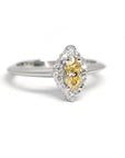 Quater side picture of yellow diamond marquise shape engagement ring bena jewelry edgy fine jewelry montreal made in canada fancy shape color diamond gia certified white gold bridal ring little italy custom made jewelry
