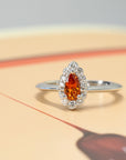 front view of pear shape garnet ring bena jewlery montreal custom color gemstone bridal jewelry handmade in montreal vivid orange engagement ring handmade in montreal little italy jewelry studio fine jewelry