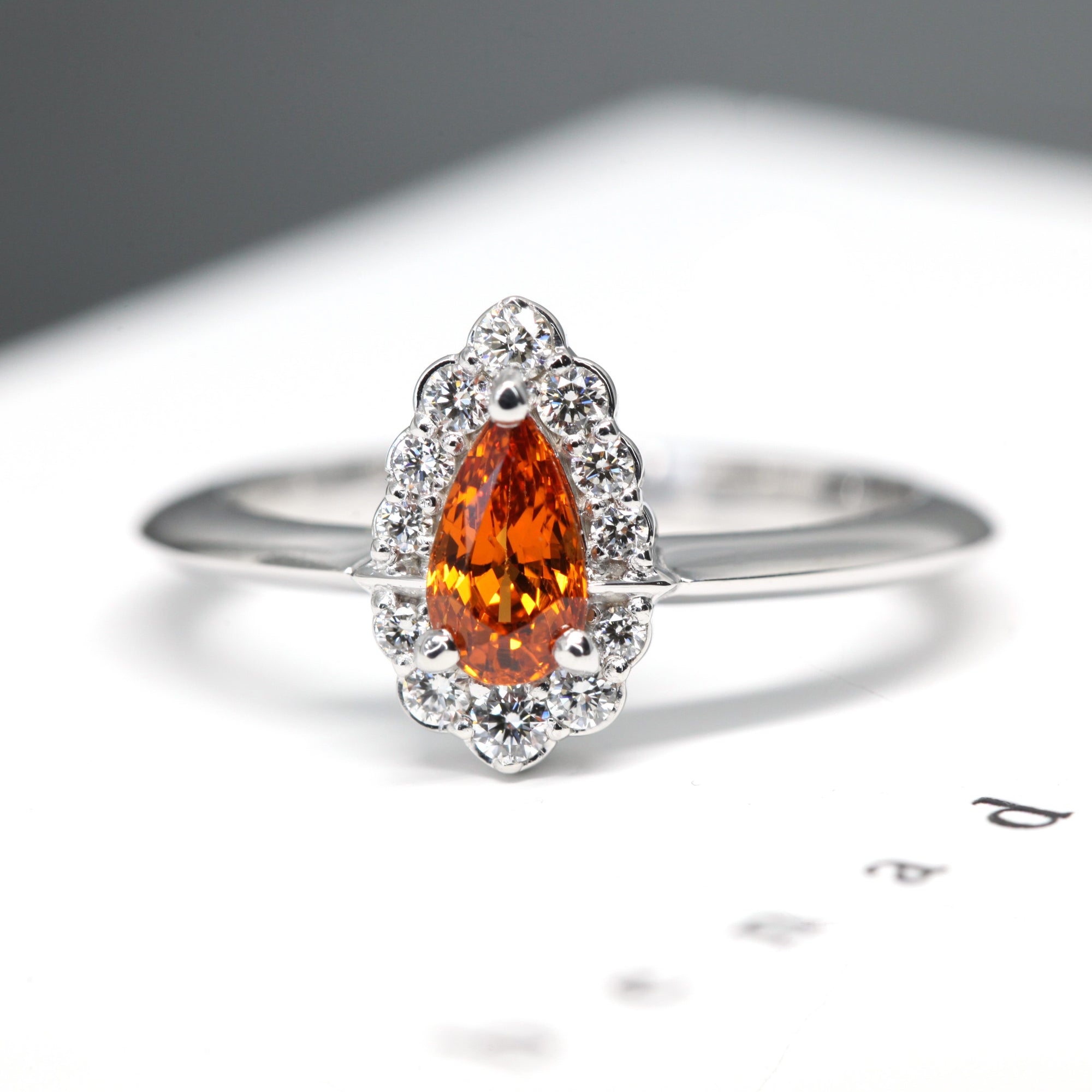 front view of pear shape orange garnet engagement ring local jewelry studio color gemstone bridal jewelry montreal bena jewlery custom color gems engagement ring montreal