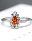 front view of pear shape orange garnet engagement ring local jewelry studio color gemstone bridal jewelry montreal bena jewlery custom color gems engagement ring montreal