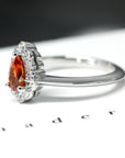 side view of pear shape orange garnet gemstone diamond engagement ring montreal handmade in canada custom made bridal jewelry color gemstone bridal engagement ring garnet spessartite pear shape gold ring