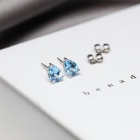 Pear shape suiss blue topaz pear shape minimalist edgy collection small stud earrings bena jewelry custom made luxury earrings natural blue color gemstone montreal made in canada