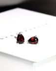 front view of red garnet pear shape studs earrings montreal bena jewelry minimalist custom made color gemstone garnet jewelry small studs pear shape red earrings montreal handmade in canada
