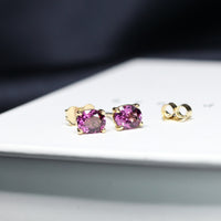 purple gemstone stud earrings bena jewelry custom made garnet jewelry bridal minimalist gemstone stud earrings made in montreal little italy fine jewelry local studio oval shape garnet gemstone earrings