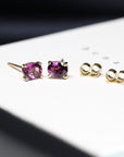 front view of rhodolite garnet gemstone stud earrings bena jewelry montreal purple natural gemstone earrings made in montreal pink gemstone earrings studs little italy jeweler