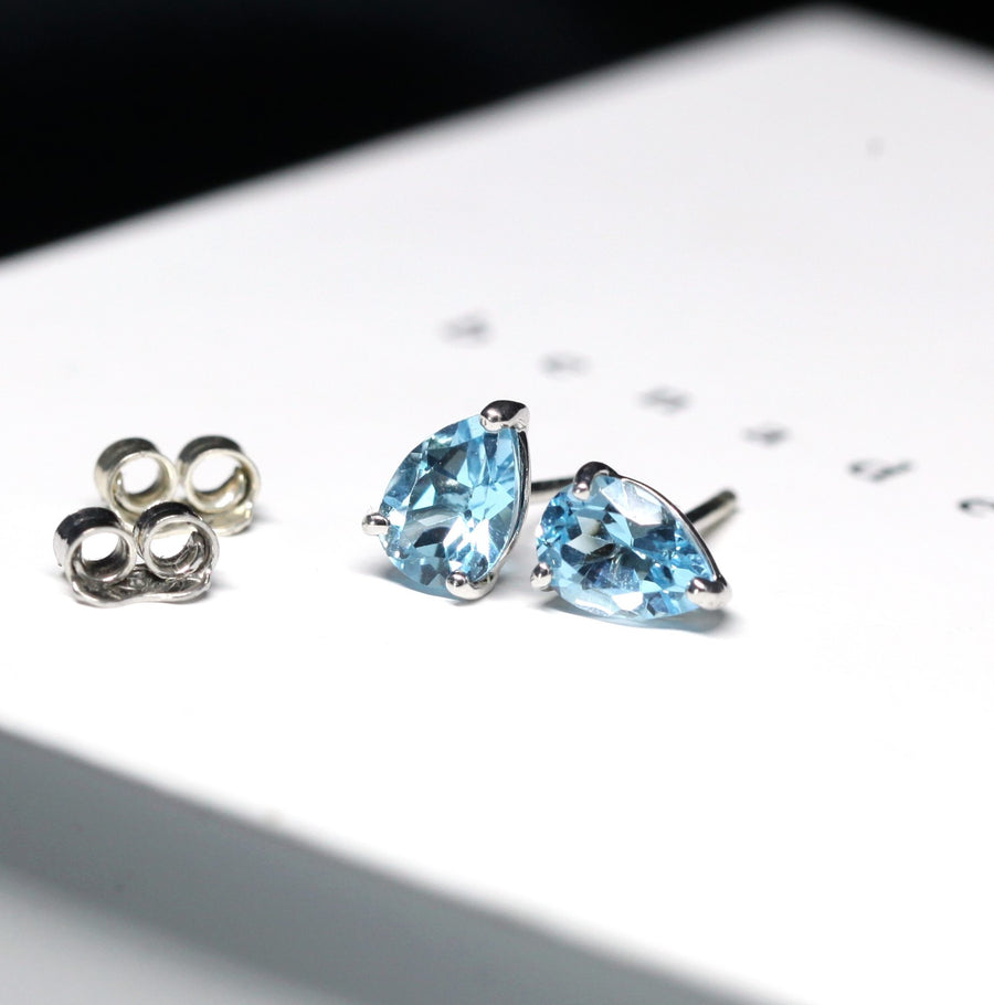 Pear shape blue topaz natural color gemstone minimalist stud earrings light blue natural color gemstone localy made in montreal canada 