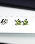 side view of bena jewelry peridot stud earrings bena jewelry custom made color gems jewelry bridal gemstone jewelry minimalist unisex gemstone stud montreal handmade in canada fine jewelry studio little italy monteal green gemstone earrings peridot gemstone