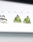 Gemstone stud earrings trillion peridot bena jewelry minimalist gemstone earrings small trillion peridot shape earrings green gemstone stud earrings bena jewelry montreal little italy jewelry studio fine color gemstone jewlery montreal made in canada jewelry designer