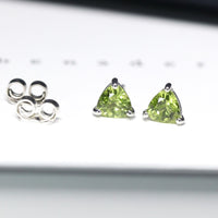 Gemstone stud earrings trillion peridot bena jewelry minimalist gemstone earrings small trillion peridot shape earrings green gemstone stud earrings bena jewelry montreal little italy jewelry studio fine color gemstone jewlery montreal made in canada jewelry designer