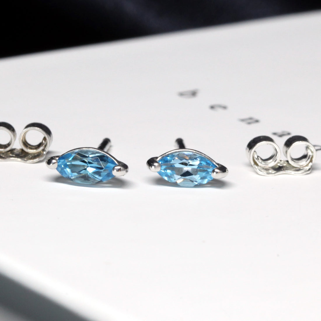 Gemstone stud earrings sterling silver marquise blue topaz