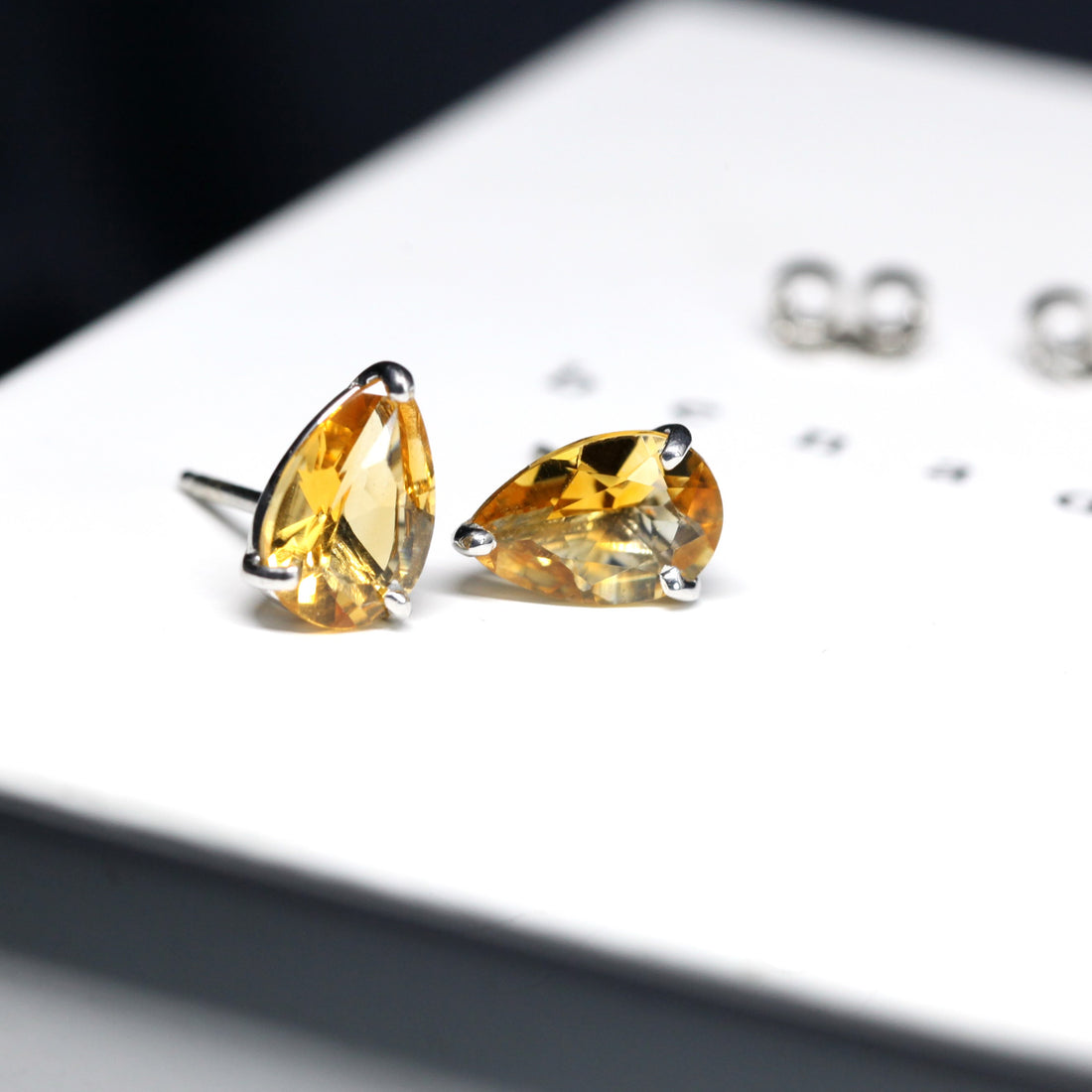 Side view of citrine pear shape stud earrings natural color gemstone fine jewelry minimalist citrine pear shape earrings little italy montreal handmade fine jewelry silver gemstone earrings bridal color gemstone jewelry