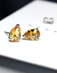 Side view of citrine pear shape stud earrings natural color gemstone fine jewelry minimalist citrine pear shape earrings little italy montreal handmade fine jewelry silver gemstone earrings bridal color gemstone jewelry