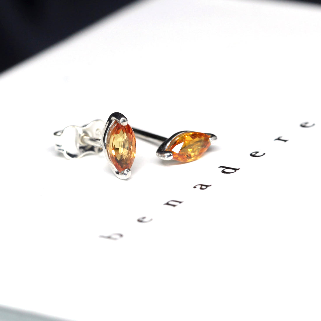 Bena Jewelry Montreal marquise shape orange sapphire color gemstone stud earrings montreal made in canada minimalist gemstone earrings with small fancy natural gemstone montreal jewelry designer little italy jeweler everyday fine jewels montreal custom color gemstone specialist