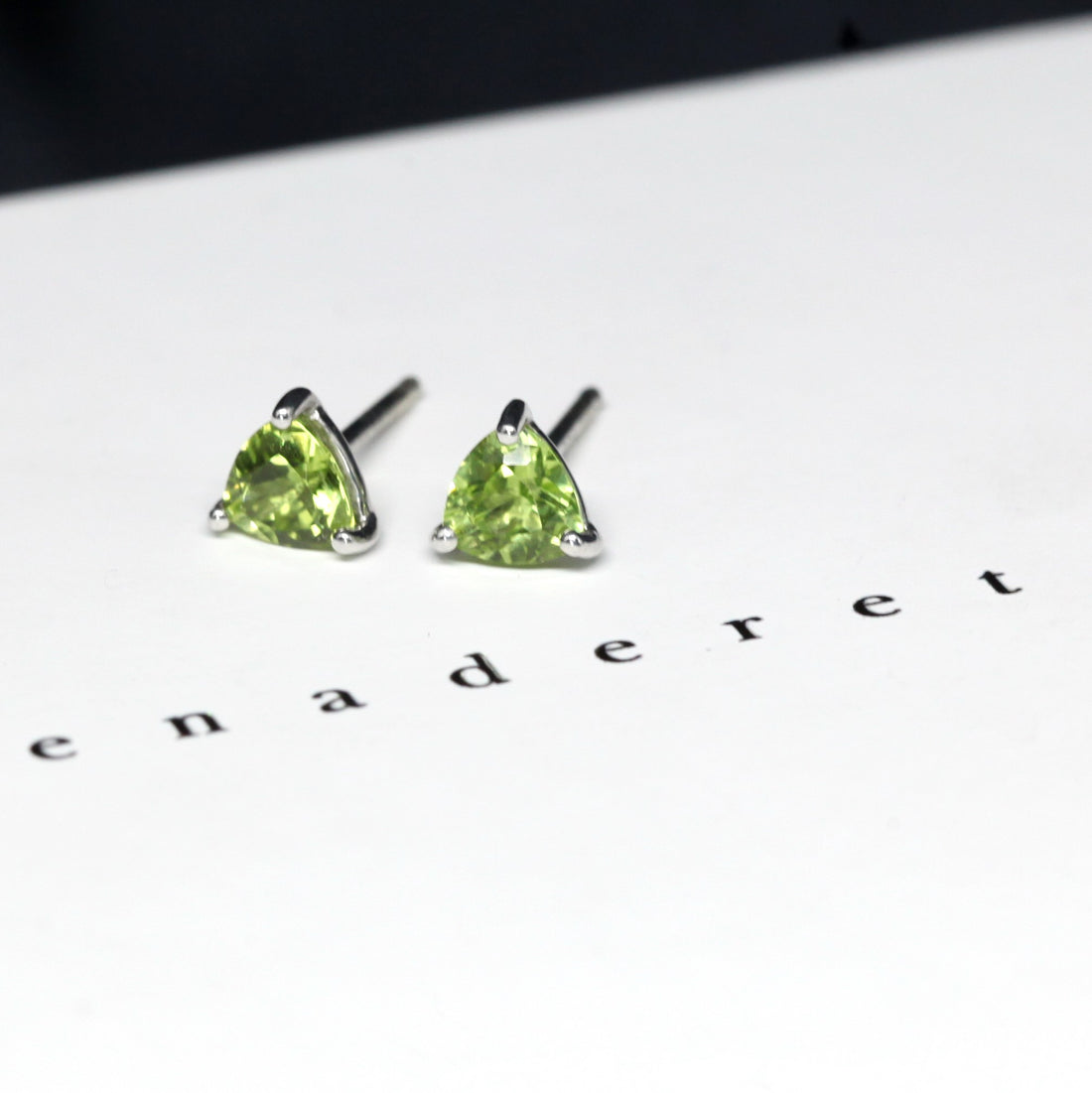 Peridot gemstone stud earrings montreal bena jewelry custom made color gemstone fine jewelry minimalist gemstone earrings studs green gemstone trillion shape earrings studs bena jewelry montreal