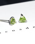 front view of bena jewelry peridot jewelry montreal cusotm made color gems bridal jewelry small trillion shape green gemstone earrings bena jewelry montreal fine jewelry designer
