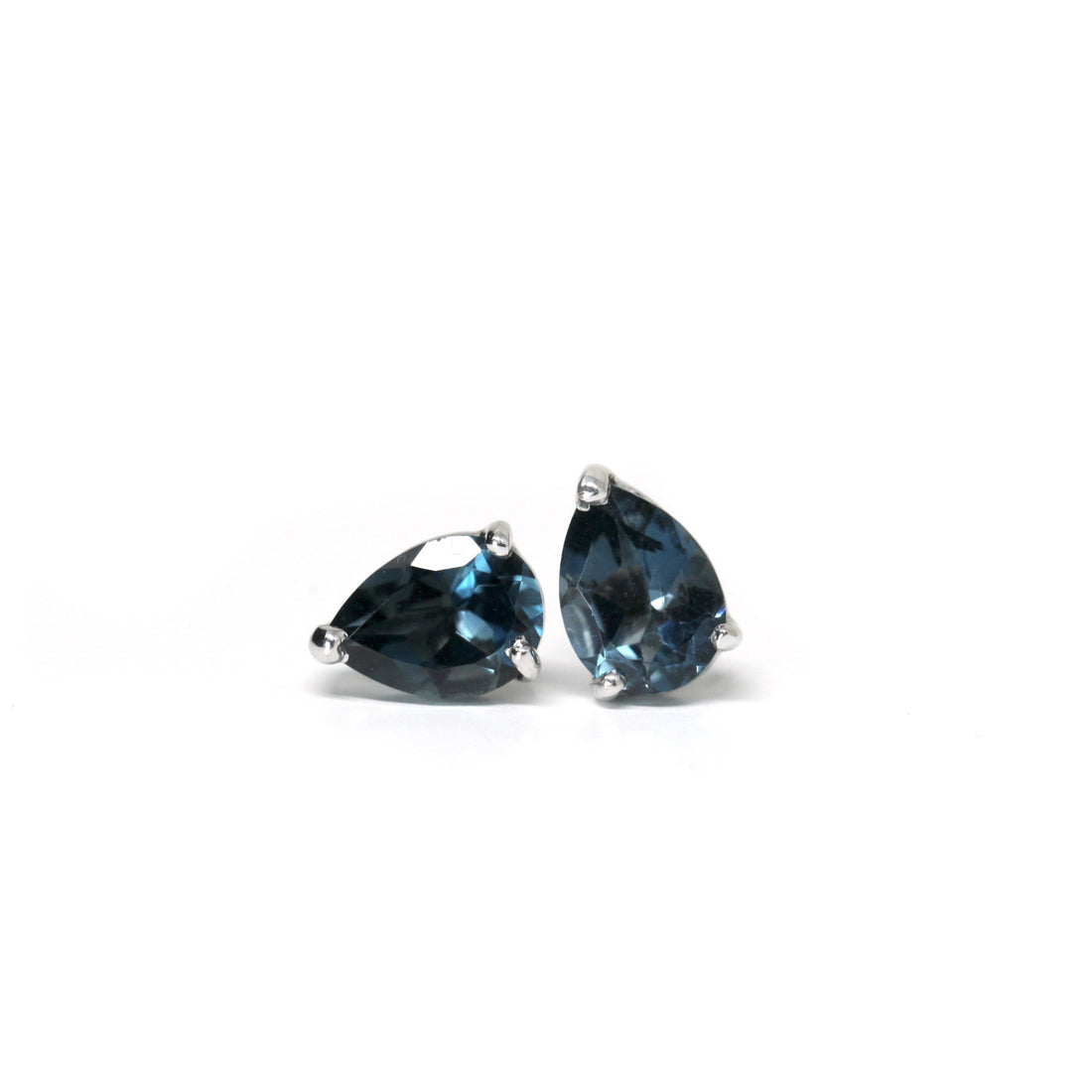 Front view of topaz pear shape stud earrings silver jewelry custom made in montreal canada fine jewelry designer fine jewelry specialist montreal hande in canada fine jewelry blue gemstone stud earrings bena jewelry edgy fine gems montreal handmade in canada