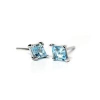 Side view of sky blue topaze studs custom made color gemstone studs sky blue color small earrings bena jewelry canada fine jewelry designer edgy collection