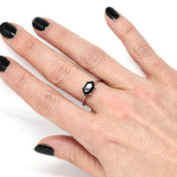 Girl wearing hexagonal black natural gemstone spinel dark gems bridal ring custom jewelry montreal color gemstone bena jewelry white gold simple bold ring edgy shapes montreal made in canada bridal jewelry