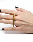Front view of girl's hand wearing double finger vermeil gold statement Edgy Bold Ring Fine jewelry designer montreal made in canada silver yellow gold plated