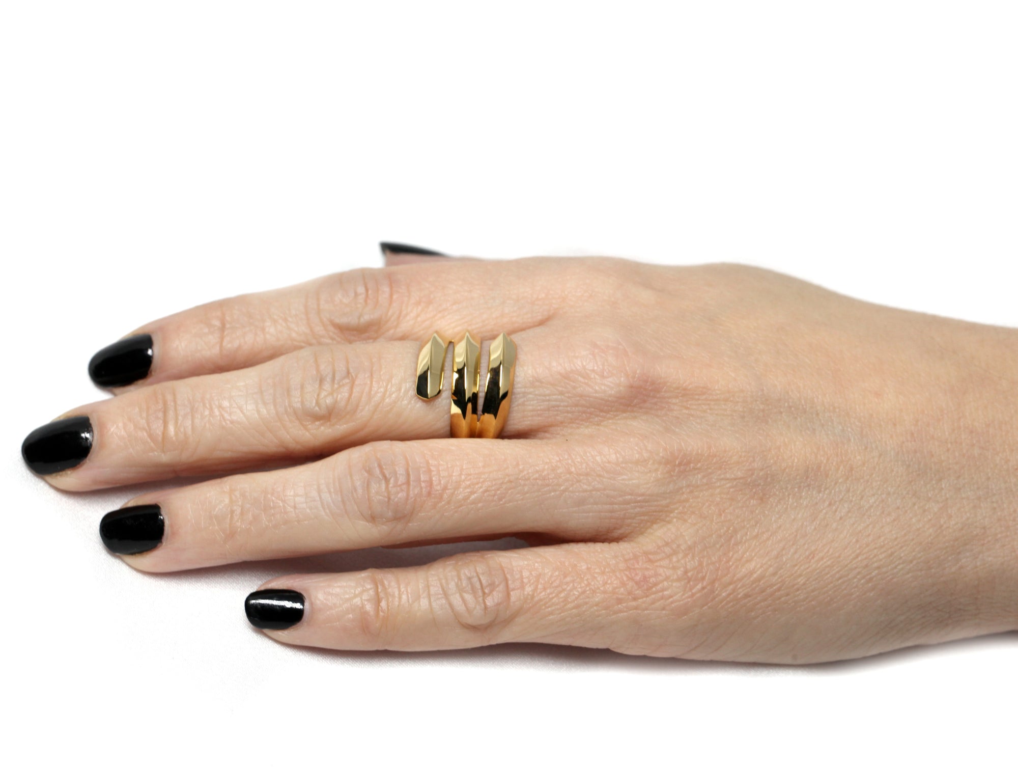 Girl wearing a vermeil gold edgy ring embrace ring silver gold plated fine jewelry custom made in montreal fine jewelry unisex jewelry design montreal made in canada