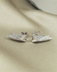 Side view of the white gold stud earrings Bena Jewelry Montreal Made in Canada one of the kind bold fine edgy jewelry