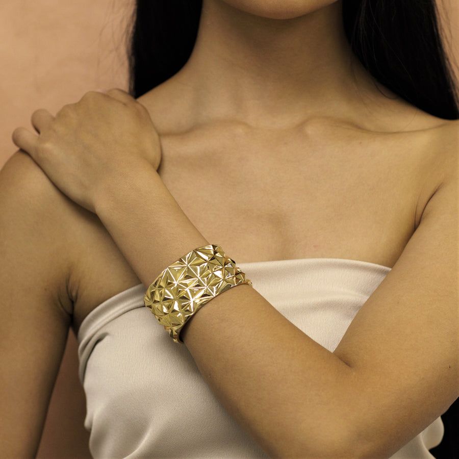 Girl wearing statement gold plated bracelet bena jewelry collection chiseled fine jewelry designer montreal made in canada