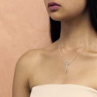 Girl wearing a silver pendant
