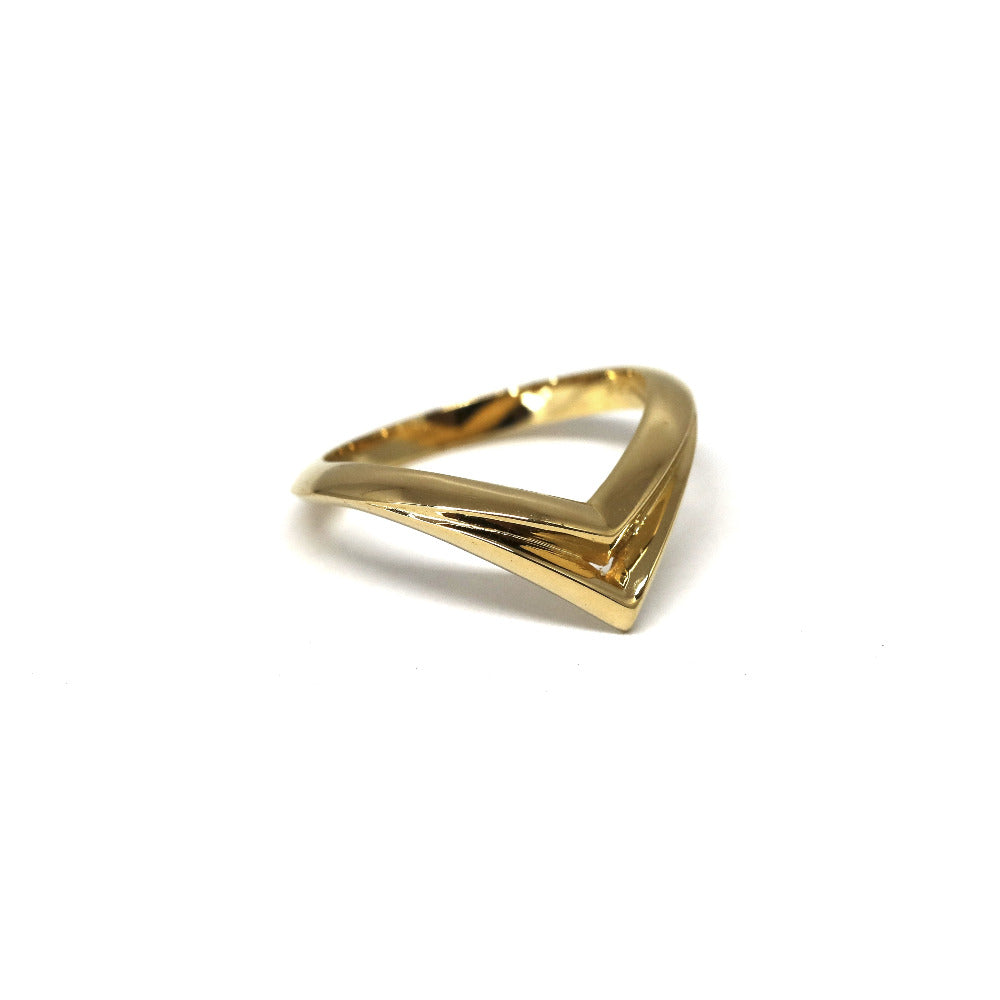 Bold V-shaped yellow gold designer ring crafted by Bena Jewelry, photographed on a white background, custom fine jewelry made in Montreal.
