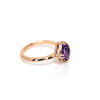 side view of rose gold statement ring with a purple gemstone amethsyt cushion cut made by bena jewelry designer montreal on a white background
