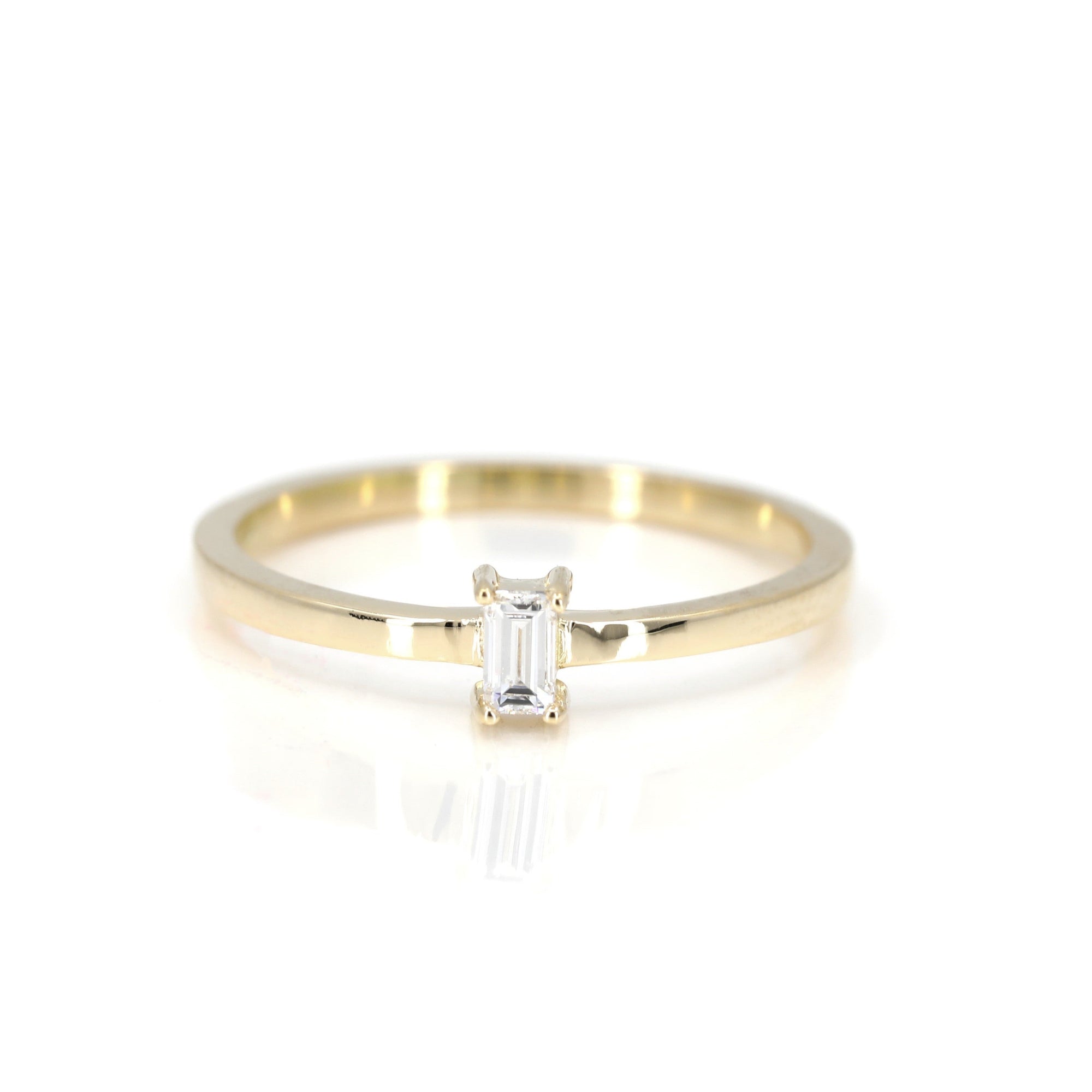 Boxy Baguette Ring in yellow gold featuring a baguette-cut diamond by Bena Jewelry photographed on a clean white background custom-made in Montreal