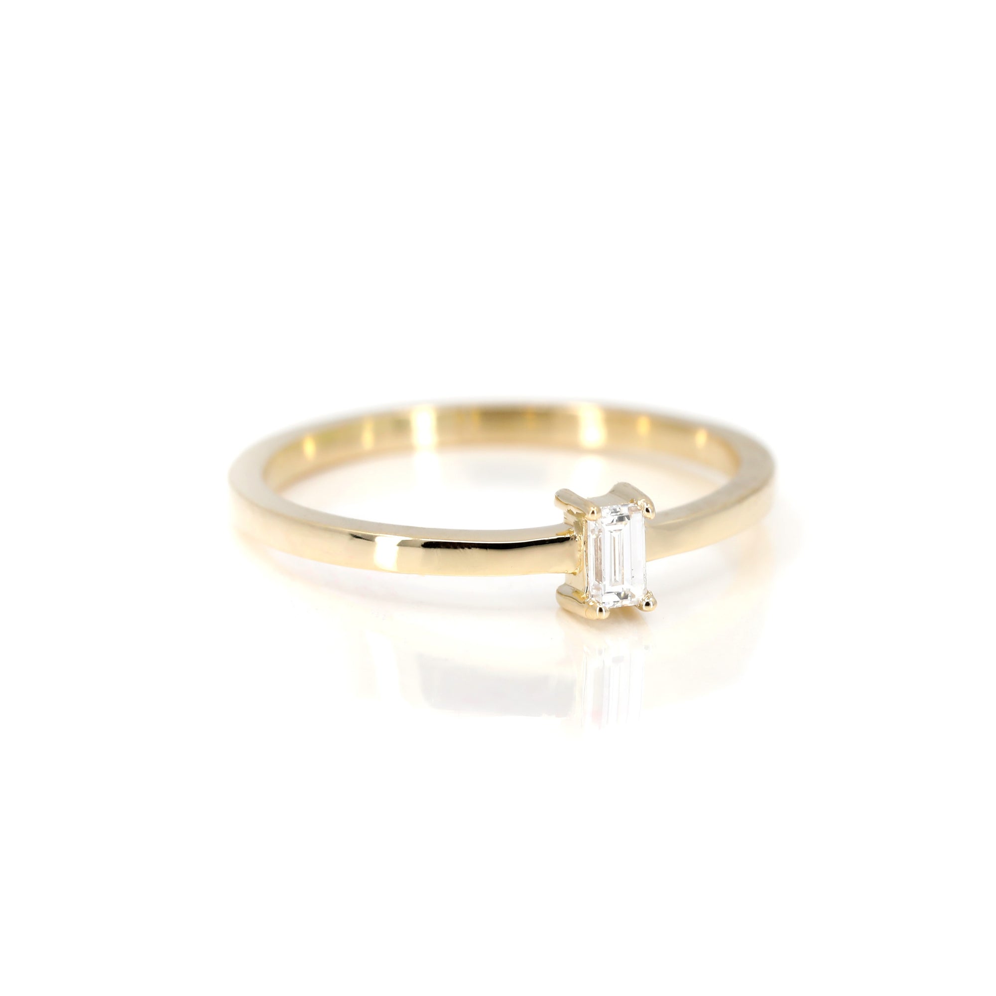 Boxy Baguette Ring in yellow gold featuring a baguette-cut diamond by Bena Jewelry photographed on a clean white background custom-made in Montreal