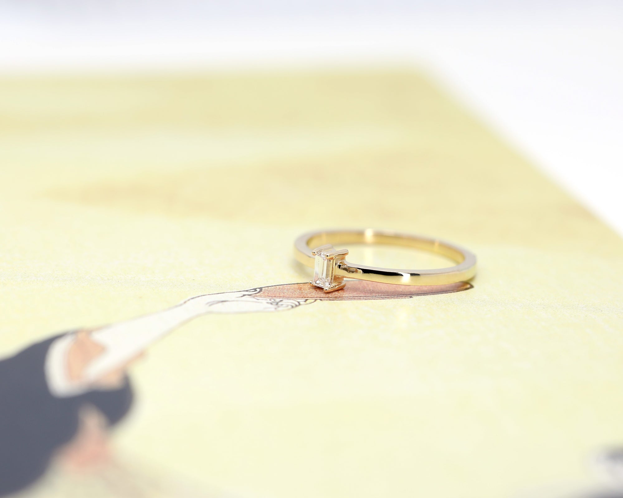 side view of edgy boxe wedding band custom made in montreal by bena jewelry designer canada best jeweler ruby mardi on yellow background