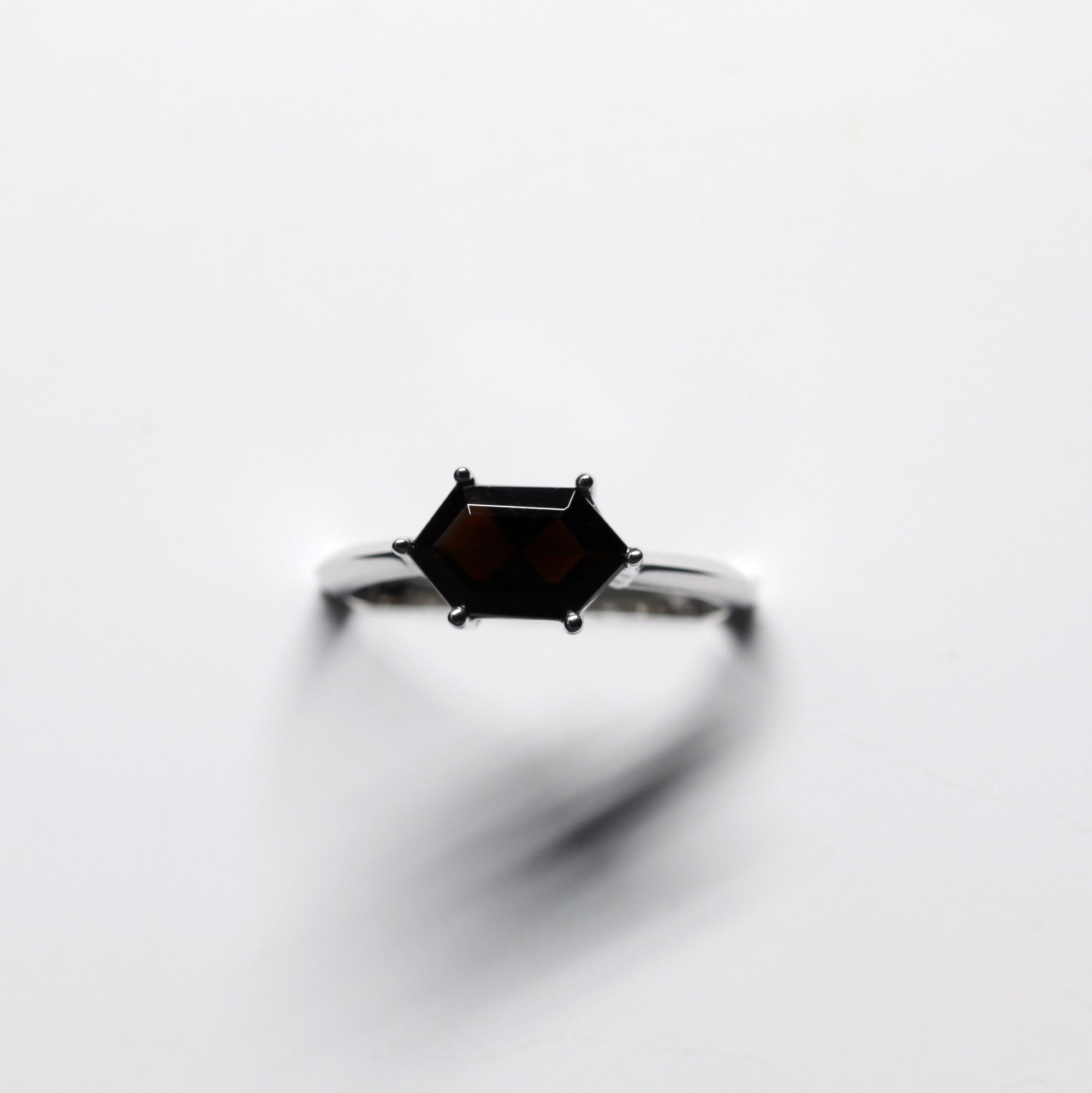 Front view of black gemstone ring bena jewelry edgy engagement ring white gold custom made jewelry montreal made in canada little italy jeweler hexagonal color gemstone black gems edgy style montreal fine jewelry