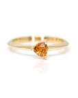 custom made colored trillion orange sapphire yellow gold bridal ring custom made in montreal by bena jewelry designer on a white background