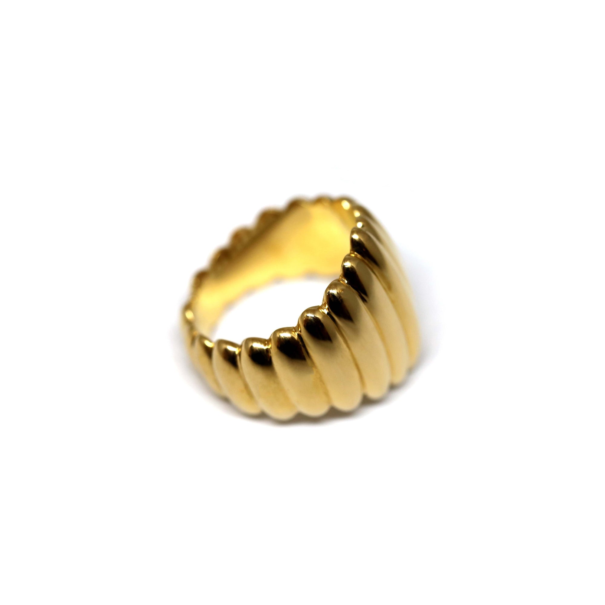 Close-up of Pigalle Ring in Yellow Gold – A statement dome ring with deep grooves and a high-polish finish.