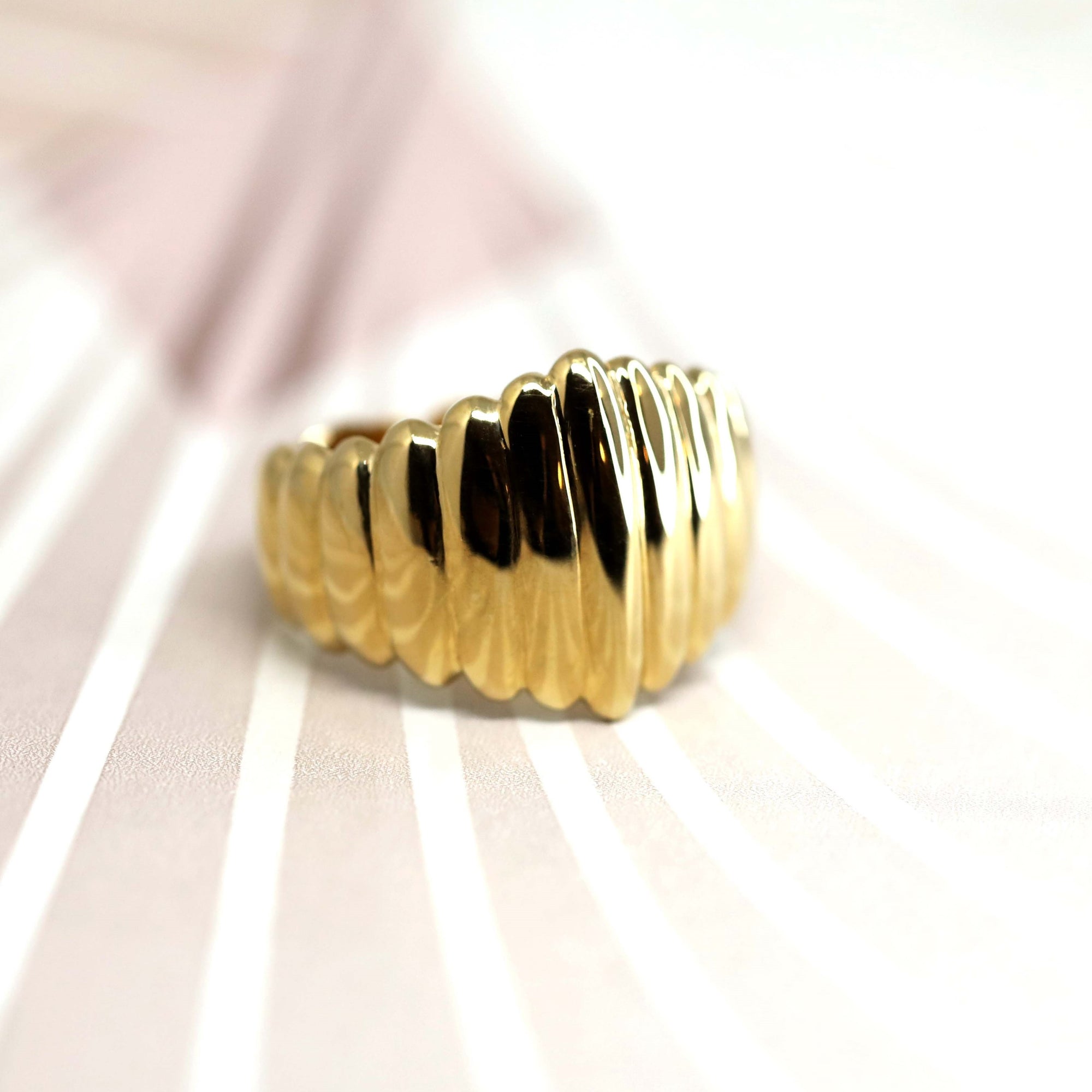 Front view of Pigalle Ring in Yellow Gold – A modern and bold statement ring with a textured surface.