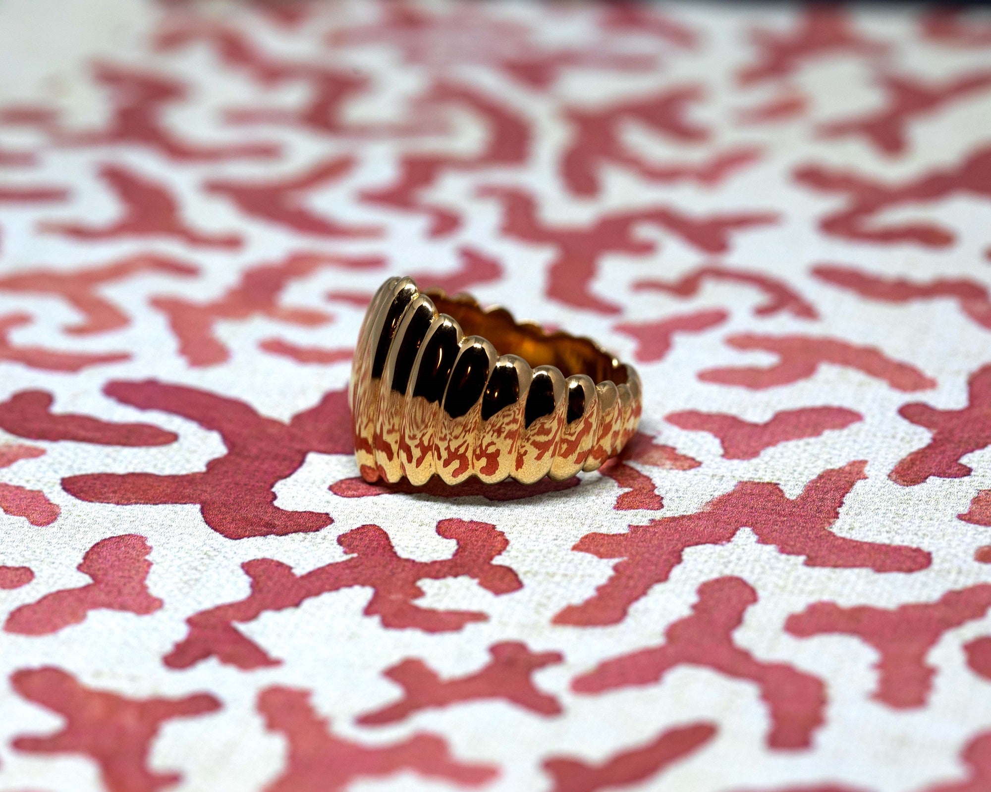  Side shot of Pigalle Ring in Yellow Gold – A highly detailed close-up showcasing the precision craftsmanship and bold ridged design.