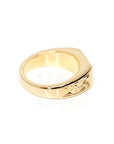 side view of edgy men gold ring made in montreal custom made by artisan the designer bena jewelry on a white background