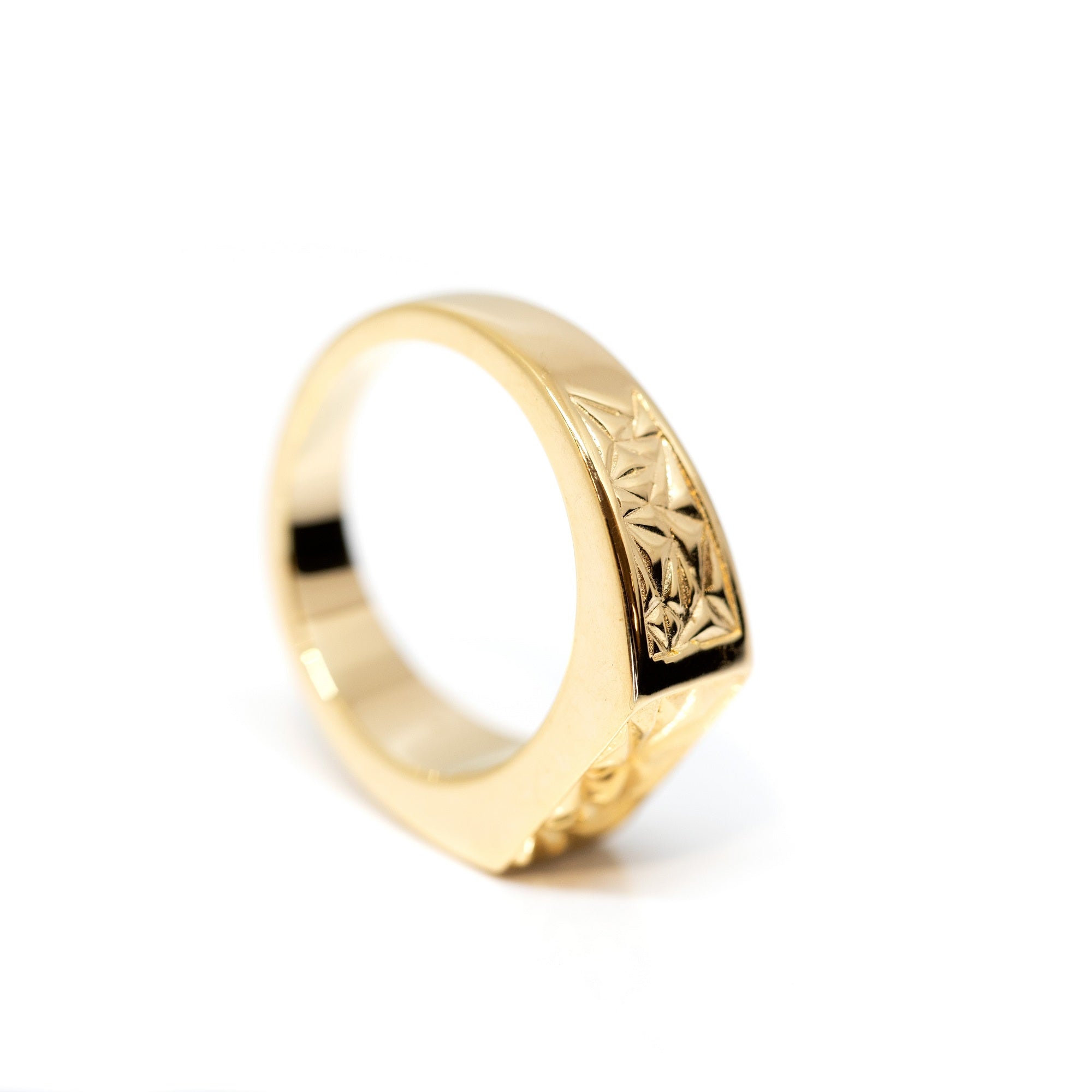 yellow gold men ring edgy design custom made in montreal by bena jewelry on a white background