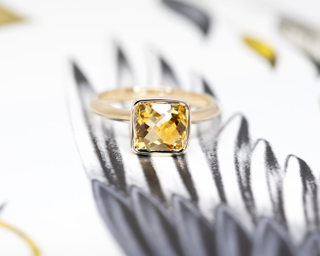 cushion citrine yellow gold designer made in montreal statement ring on a muti color background