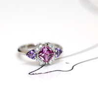 side view square pink and purple sapphire and diamond platimum ring custom made jewels in bena jewelry on white background