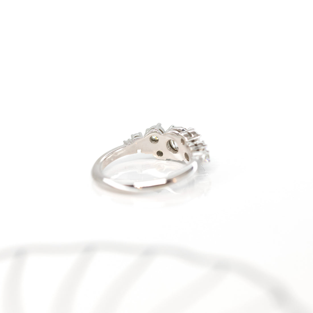 back view of a white gold designer engagement ring custom made in montreal on a white background