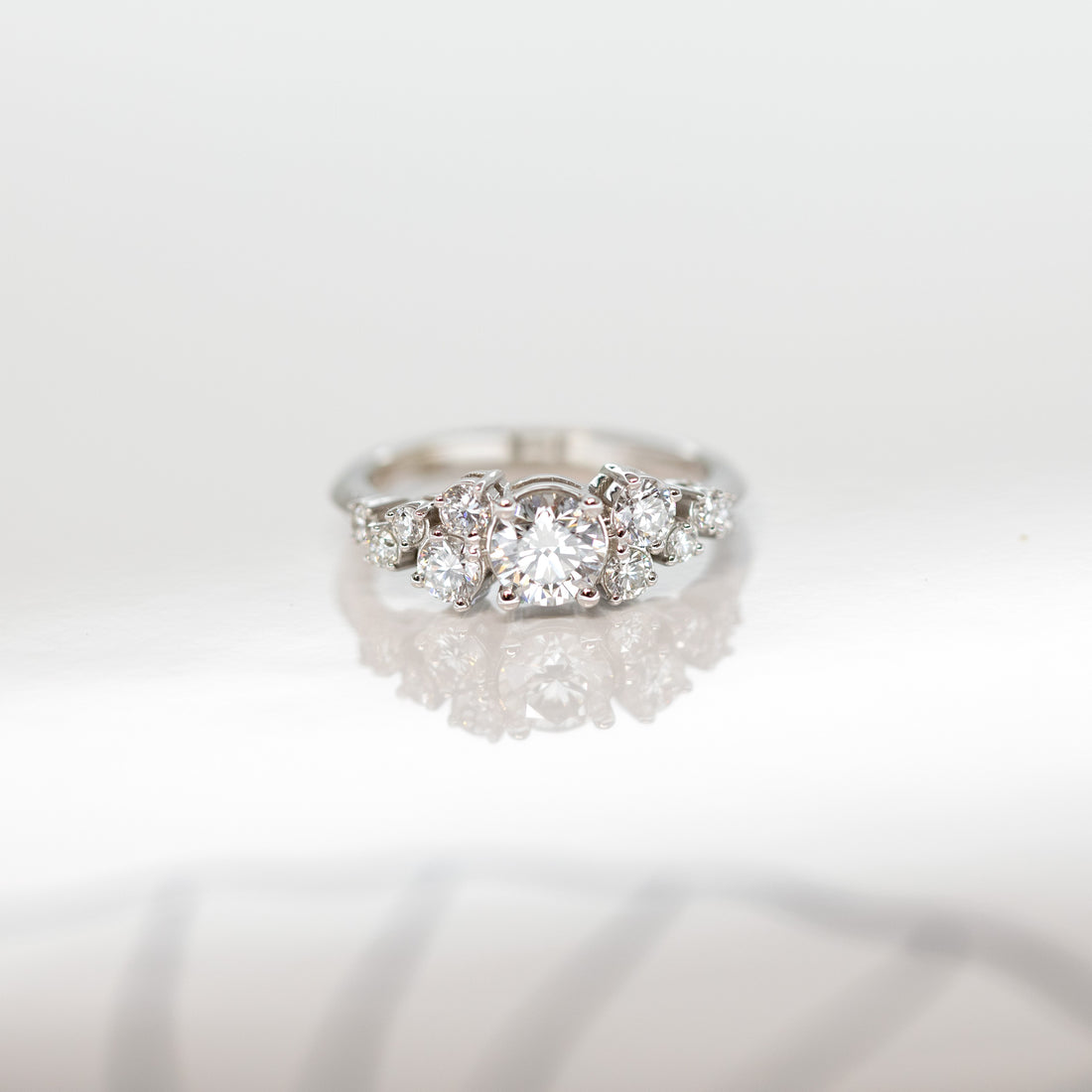 front view of a round diamond engagement ring custom made in montreal by bena jewelry fine jewellery designer on a white background